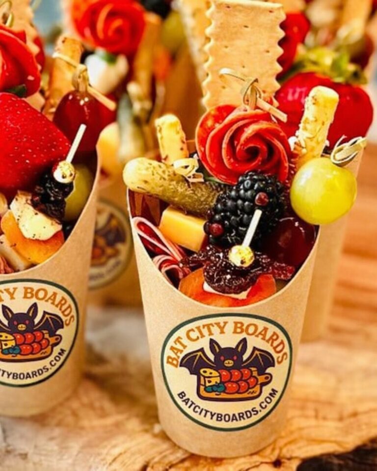 Charcuterie cups with salami roses, berries, pickles and breadsticks