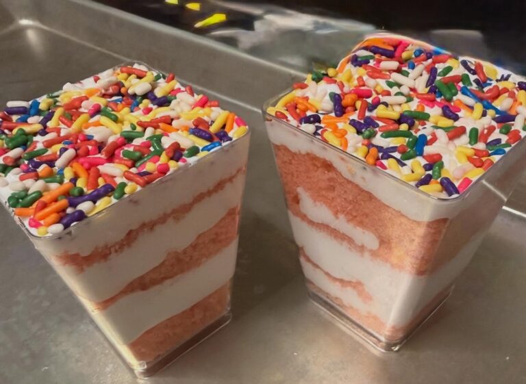Layered dessert cups with rainbow sprinkles