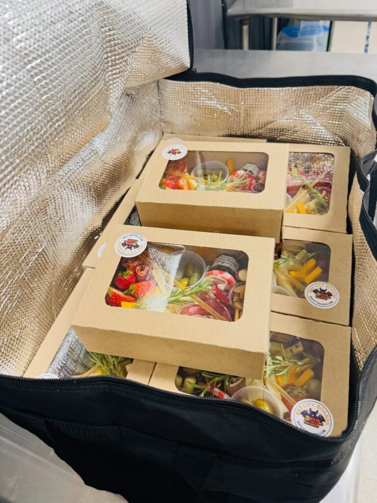 Elevated boxes packed in an insulated delivery bag