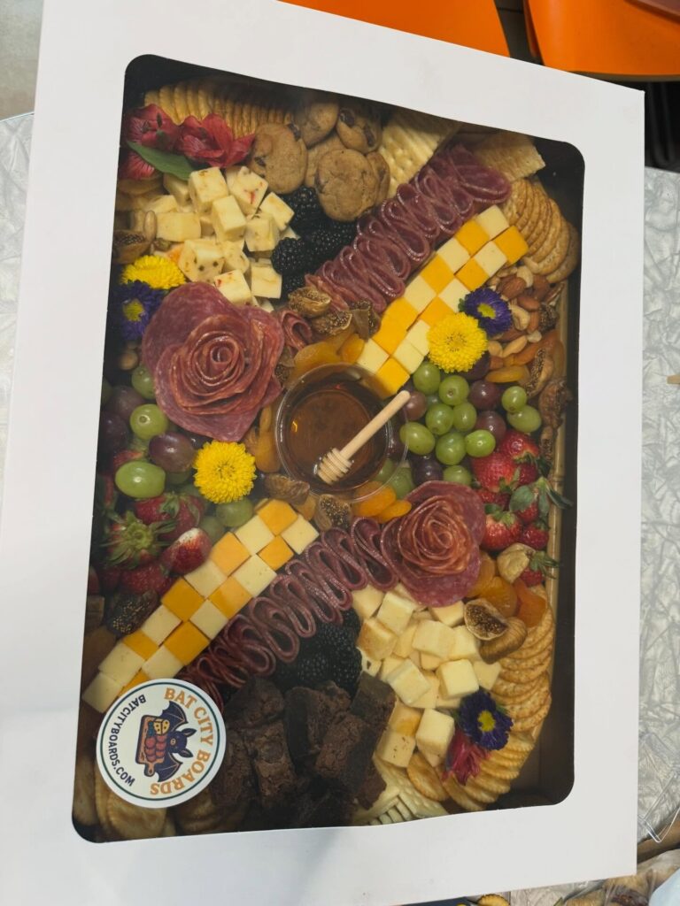 Medium charcuterie board in a white window box with salami roses and flowers