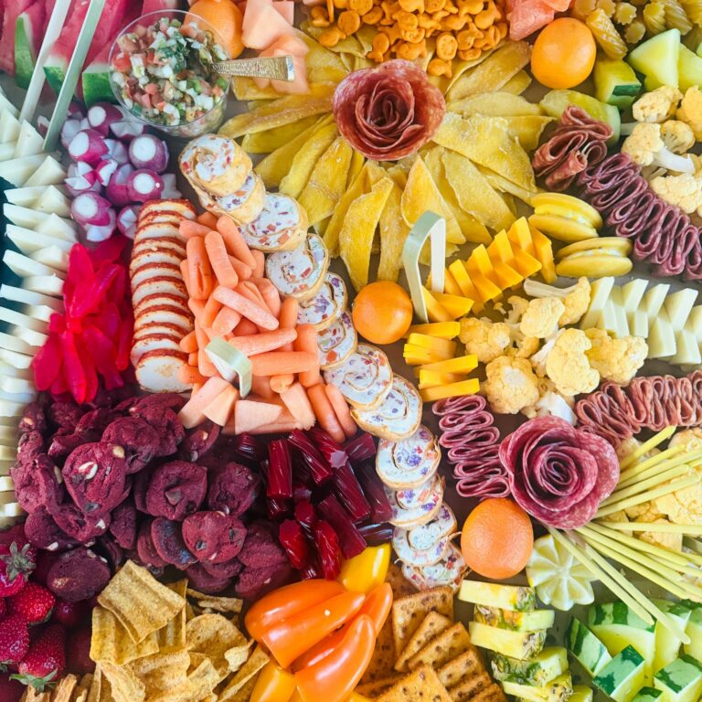 Close-up with salami roses, carrots and peppers
