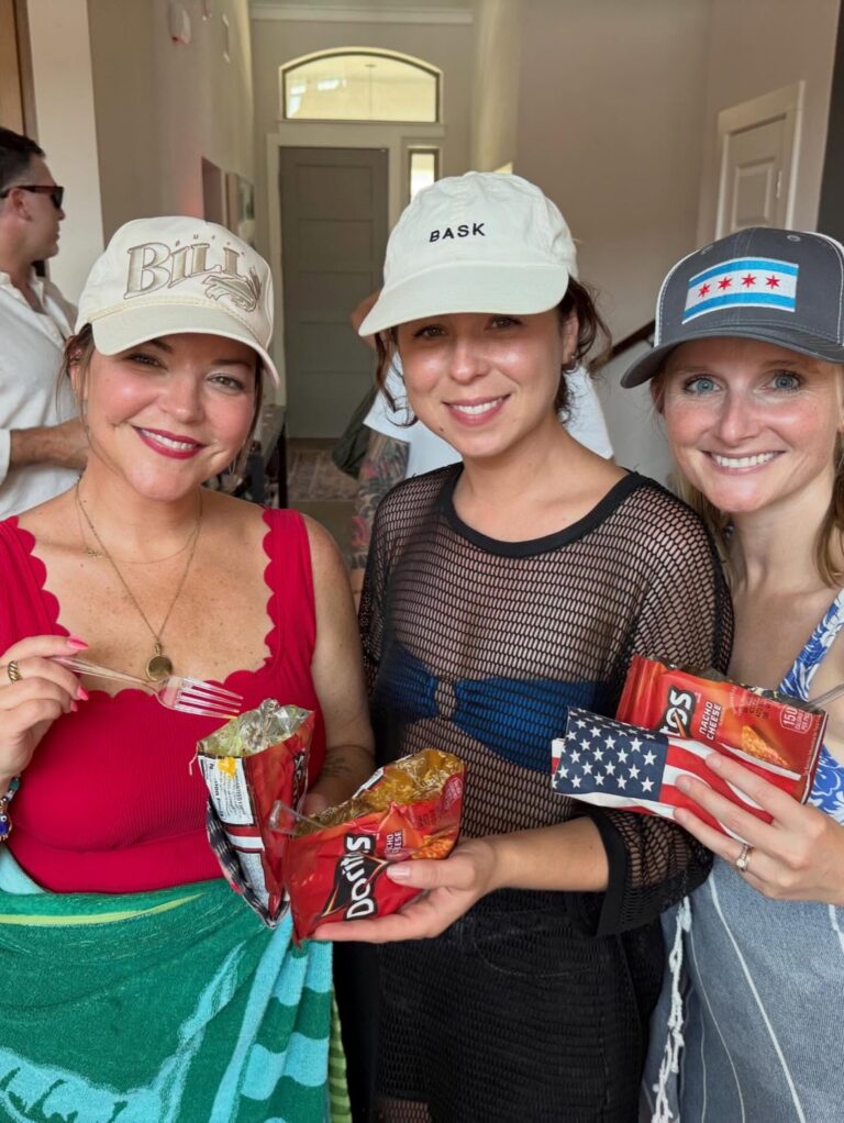 Party guests holding walking taco bags